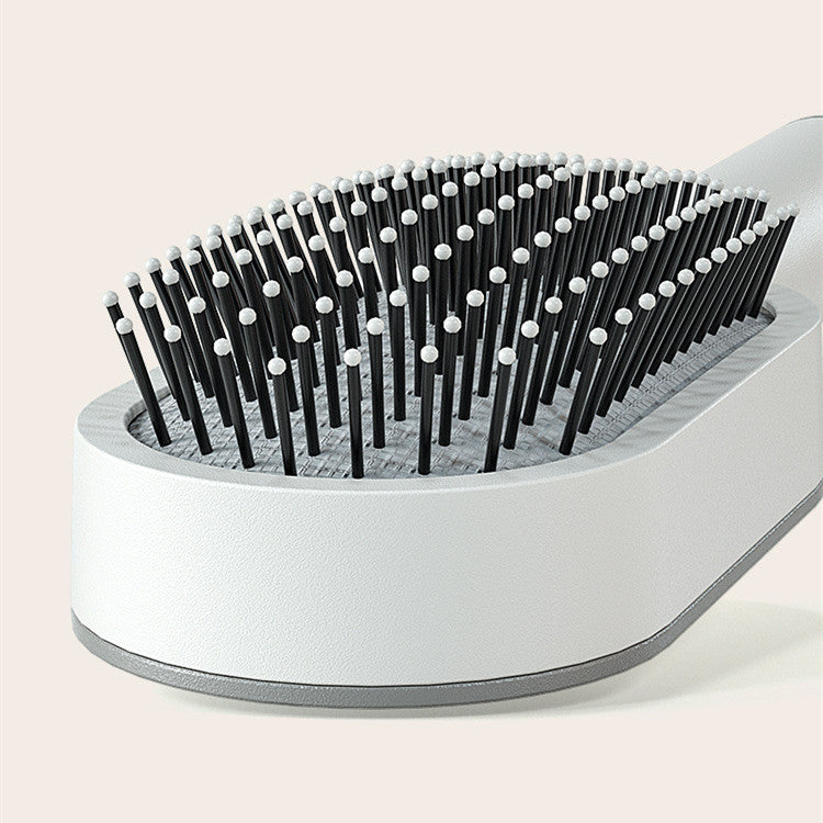 self-cleaning hair brush